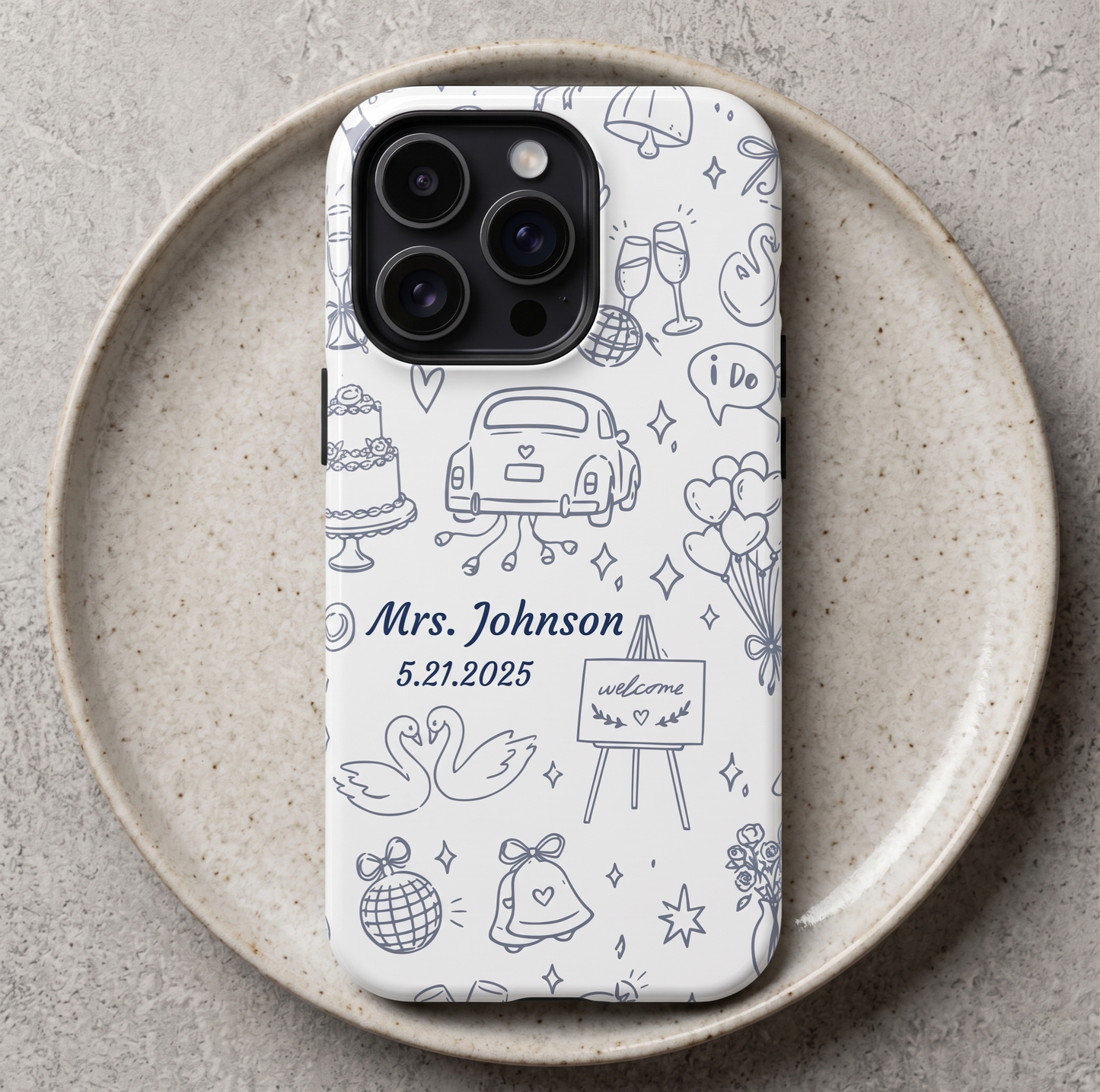 Custom bride phone case in navy blue with hand-drawn wedding icons including cake, getaway car, swans and bells personalized with name and date