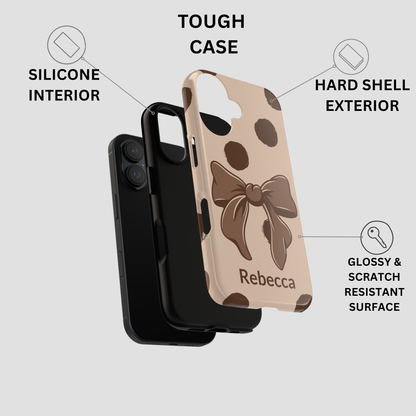 Phone case with a bow design and 'Rebecca' text, featuring text labels on a gray background.