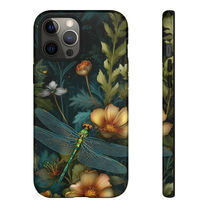 Detailed view of a dark moody floral phone case with a shimmering teal dragonfly and lush green leaves.