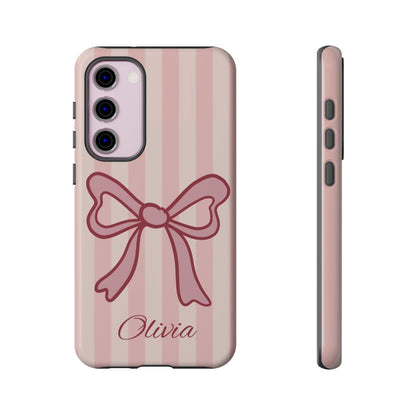 Custom name phone case in a soft pastel pink palette with a large preppy bow design.