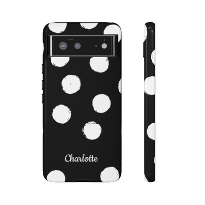 A black phone case with a white hand-drawn polka dot pattern, featuring the name 'Charlotte' printed in white script near the bottom. Shown in a back view and a side profile view against a plain white background.