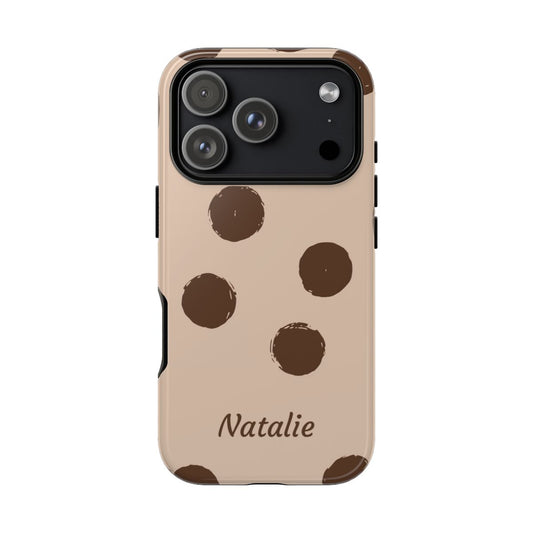 Brown polka dot phone case with custom cursive name on neutral background