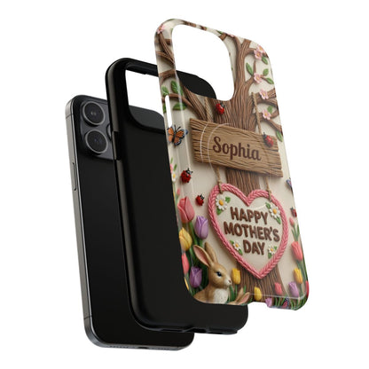 Close-up of a whimsical personalized phone cover showing detailed cherry blossoms, a hanging wooden sign, and "Happy Mother's Day" text.